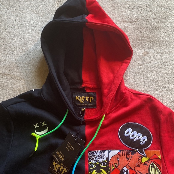 I'm selling a brand new sweater, black and red really nice designs - Picture 4 of 4